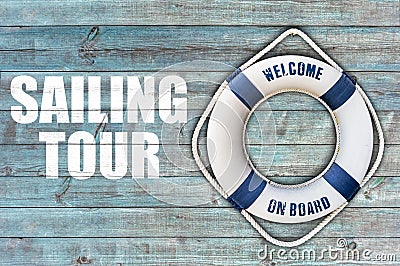 Lifebuoy on wooden floor and sailing tour Stock Photo