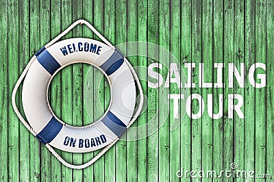 Lifebuoy on wooden floor and sailing tour Stock Photo