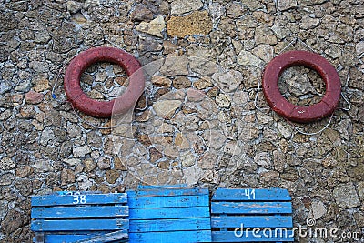 Lifebuoys at the wall Stock Photo