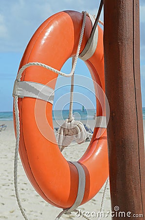 Lifeguard beach rescue equipment orange lifebuoy Stock Photo