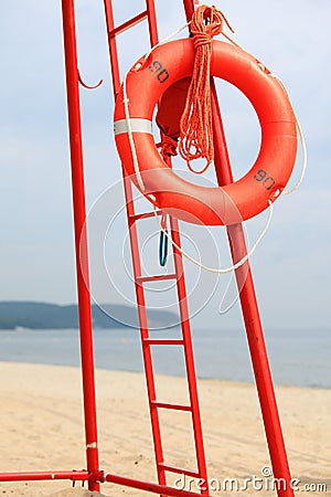Lifeguard beach rescue equipment orange lifebuoy Stock Photo