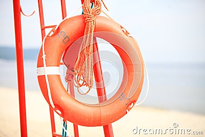 Lifeguard beach rescue equipment orange lifebuoy Stock Photo