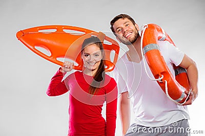 Lifeguard couple with rescue equipment Stock Photo