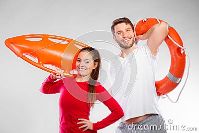 Lifeguard couple with rescue equipment Stock Photo