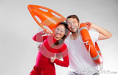 Lifeguard couple with rescue equipment Stock Photo