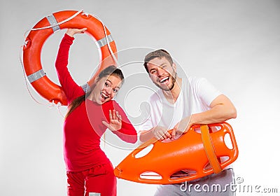 Lifeguard couple with rescue equipment Stock Photo