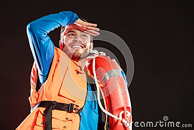 Lifeguard in life vest with ring buoy lifebuoy. Stock Photo
