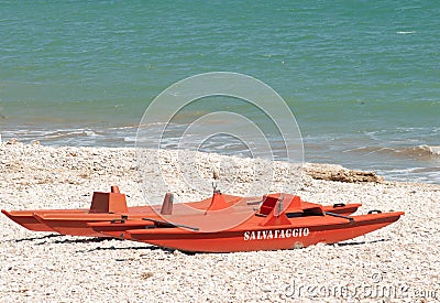 Lifeguard, rescue boat, on gravel, coastline of, Fossacesia beach, Italy, on Adriatic sea Editorial Stock Photo