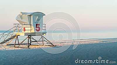 Lifeguard station on a beautiful white sand Florida beach with blue water. Stock Photo