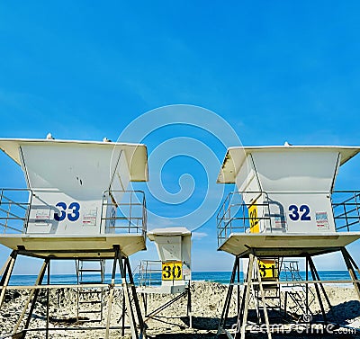 Shores Sentry: Lifeguard Towers and Seagulls on La Jolla Shores Beach Stock Photo