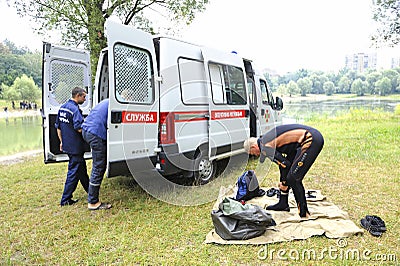 Lifeguards preparing diving equipment in front of rescue mobile post. Kiev,Ukraine Editorial Stock Photo