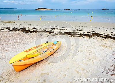 Lifeguards rescue surfboard and kayak lying on the beach Editorial Stock Photo