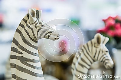 Lifelike plastic zebra sculpture toy set on display Stock Photo