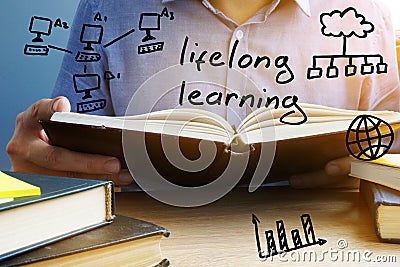 Lifelong learning concept. Man reading the book. Stock Photo