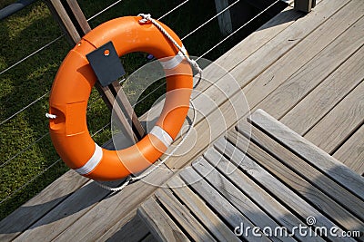 Lifesaver next to a bench Stock Photo