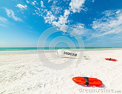 Lifesavers and rescue surfboard on the sand in beautiful Siesta Key Stock Photo