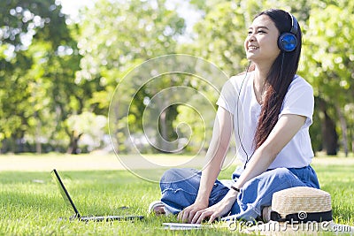 Lifestyle of cute young Asian woman is remotely working at the Park Stock Photo