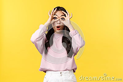 Lifestyle, emotions and advertisement concept. Amazed and impressed asian woman drop jaw from awesome news, looking Stock Photo