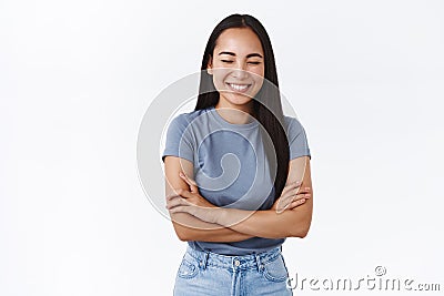 Lifestyle, emotions and happiness concept. Attractive smiling happy asian woman, close eyes as chuckling from funny joke Stock Photo