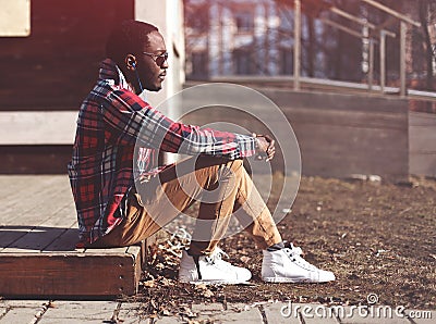 Lifestyle fashion portrait of stylish young african man Stock Photo