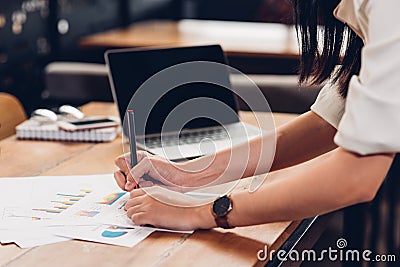 Lifestyle freelance woman and laptop computer he examined the graph profit docume Stock Photo