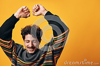 Man fashion happy portrait sweater orange trendy background Stock Photo