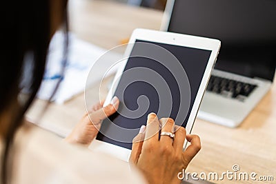 Lifestyle with modern woman using tablet or Ipad with hand holding touchscreen. Hands of working woman with Smart Tablet Stock Photo