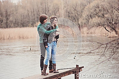 Lifestyle outdoor capture of young loving couple on the walk in early spring Stock Photo