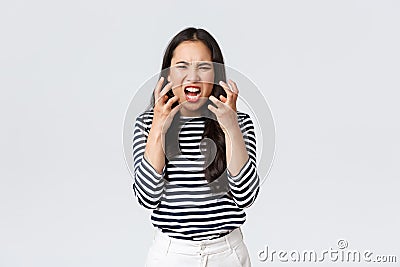 Lifestyle, people emotions and casual concept. Mad distressed asian woman losing temper, cant stand it anymore, release Stock Photo