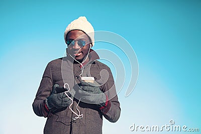 Lifestyle portrait of free young african man listening music Stock Photo