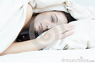 Beautiful sensual young woman in white morning bed Stock Photo