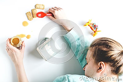 Lifestyle tired mother top view on white background Stock Photo