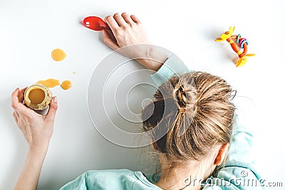 Lifestyle tired mother top view on white background Stock Photo