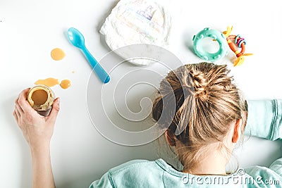 Lifestyle tired mother top view on white background Stock Photo