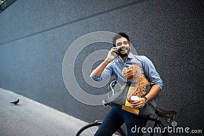 Lifestyle, transport, communication and people concept . Young man with bicycle and smartphone on city street Stock Photo