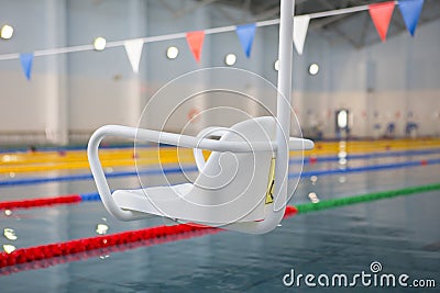 Lift for the descent of people with disabilities into the pool. Stock Photo