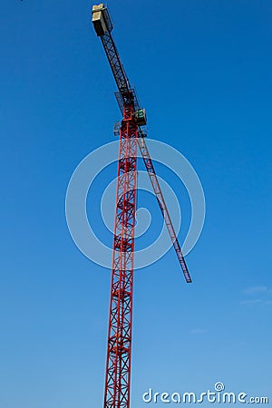 Lifting crane on the background of a blue sky Editorial Stock Photo