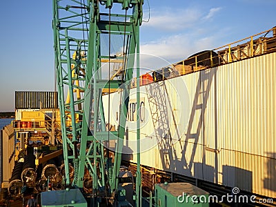 Lifting crane on the deck of a pipe laying barge. Editorial Stock Photo