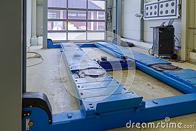 A lifting platform in a car repair shop Stock Photo