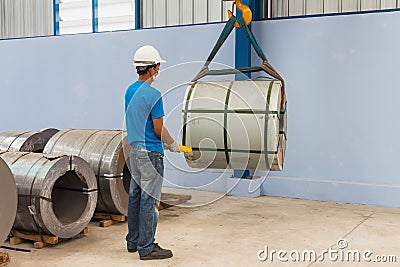 Lifting steel coil Stock Photo