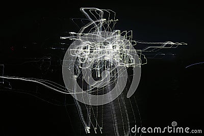 Light abstractions obtained at night on the water. Stock Photo