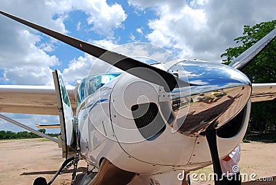 A light aircraft on an airstrip ferrying tourists to and from remote safari lodges in Tanzania Editorial Stock Photo