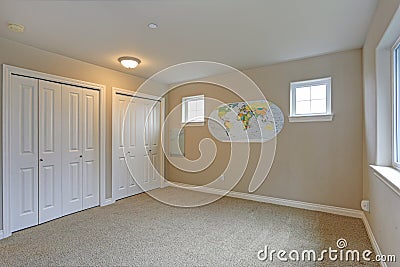 Light beige room interior with white closet doors. Stock Photo