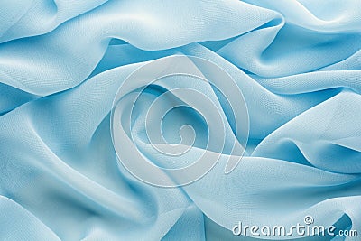 Light blue fabric draped with large folds, delicate textile background Stock Photo