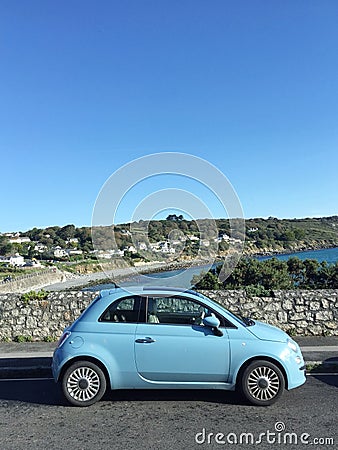 Blue Fiat 500 lifestyle at coast Editorial Stock Photo