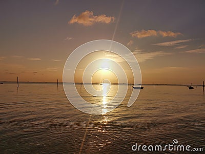 Light boat sun ray water beach warm Stock Photo