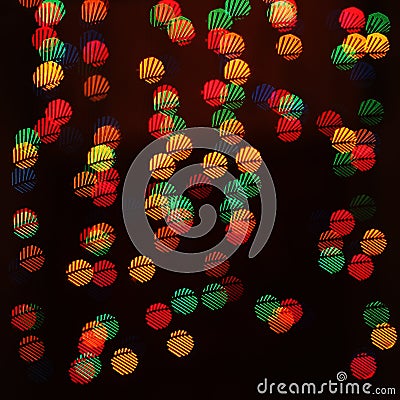 A light bokeh pattern of geometric elements on a dark background Stock Photo
