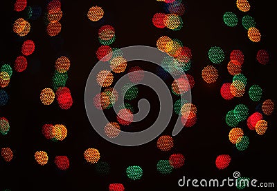A light bokeh pattern of geometric elements on a dark background Stock Photo