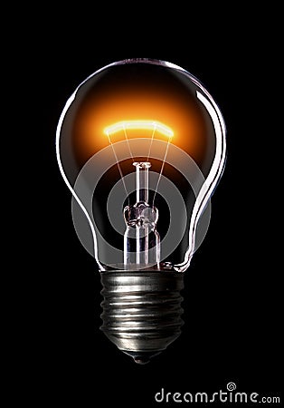 Light bulb on black background. Stock Photo