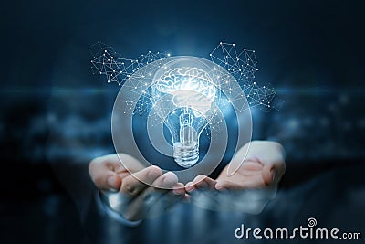 Light bulb with brain inside the hands of the businessman. Stock Photo